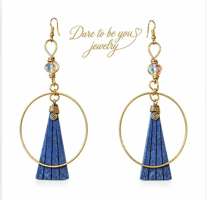 Afrocentric blue bone and gold hoop statement earrings isolated on white background showing full design detail
