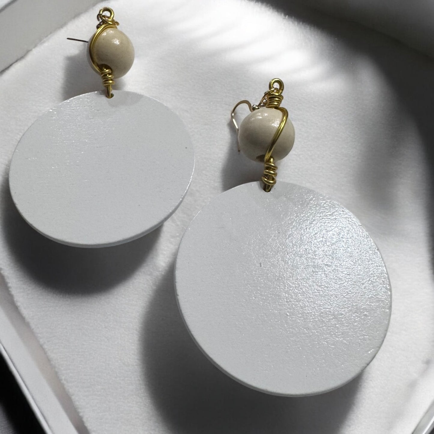 White Round Wood Earrings With A Handmade Twist