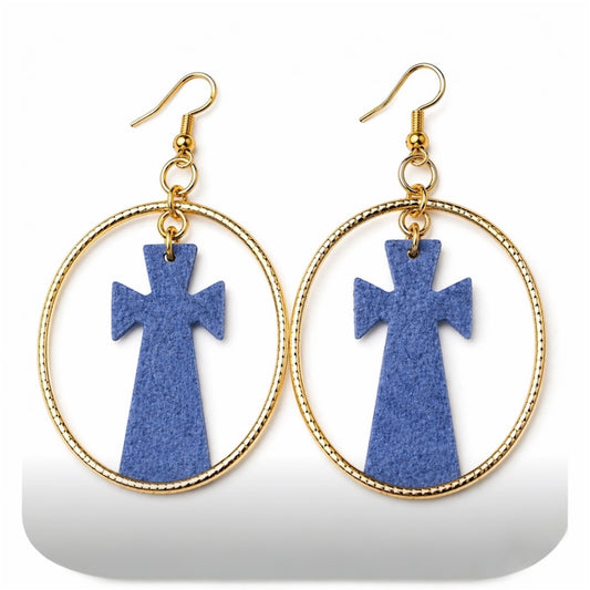 Close up of afrocentric grey cross hoop earrings on white background showing texture and gold hoop detail