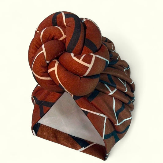 Elevate your style with our Oversized Knotted Brown And White Turban Headwrap! Made with breathable polyester fabric and incredible stretch, it's convenient slip-on design makes it a one size fits all accessory. Pair it with our Dare To Be You jewelry earrings for a stunning look. Embrace culture and your unique self for just $8!