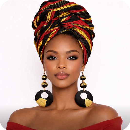 afrocentric black gold heritage statement earrings on dark skin woman wearing red and gold patterned headwrap bold cultural statement jewelry