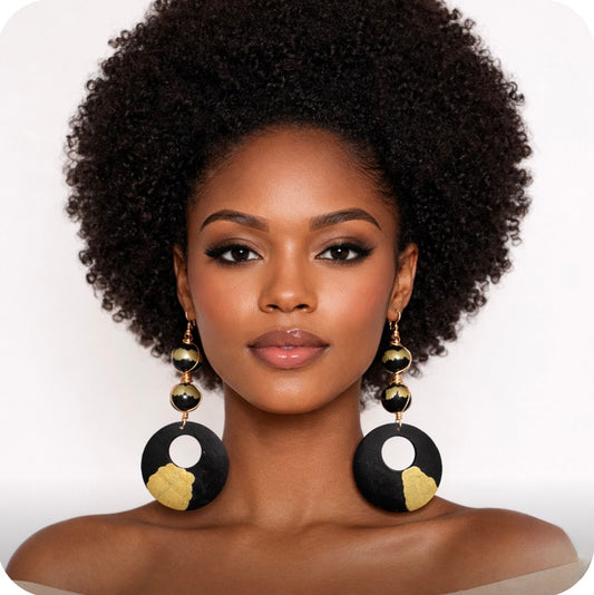 afrocentric black gold heritage statement earrings on dark skin woman with full afro front facing bold statement jewelry