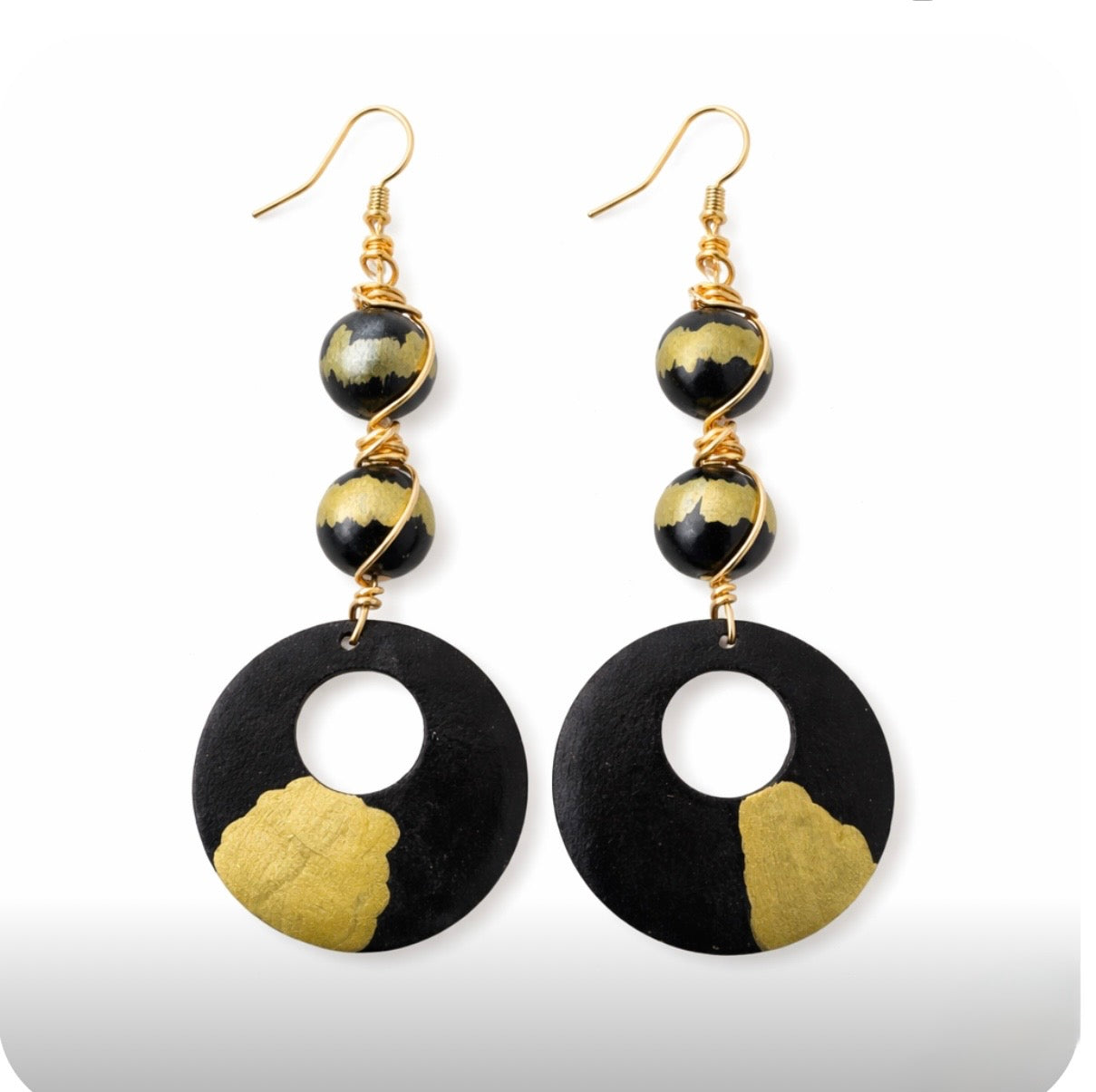 afrocentric black gold heritage statement earrings handmade wood earrings with gold accents on white background