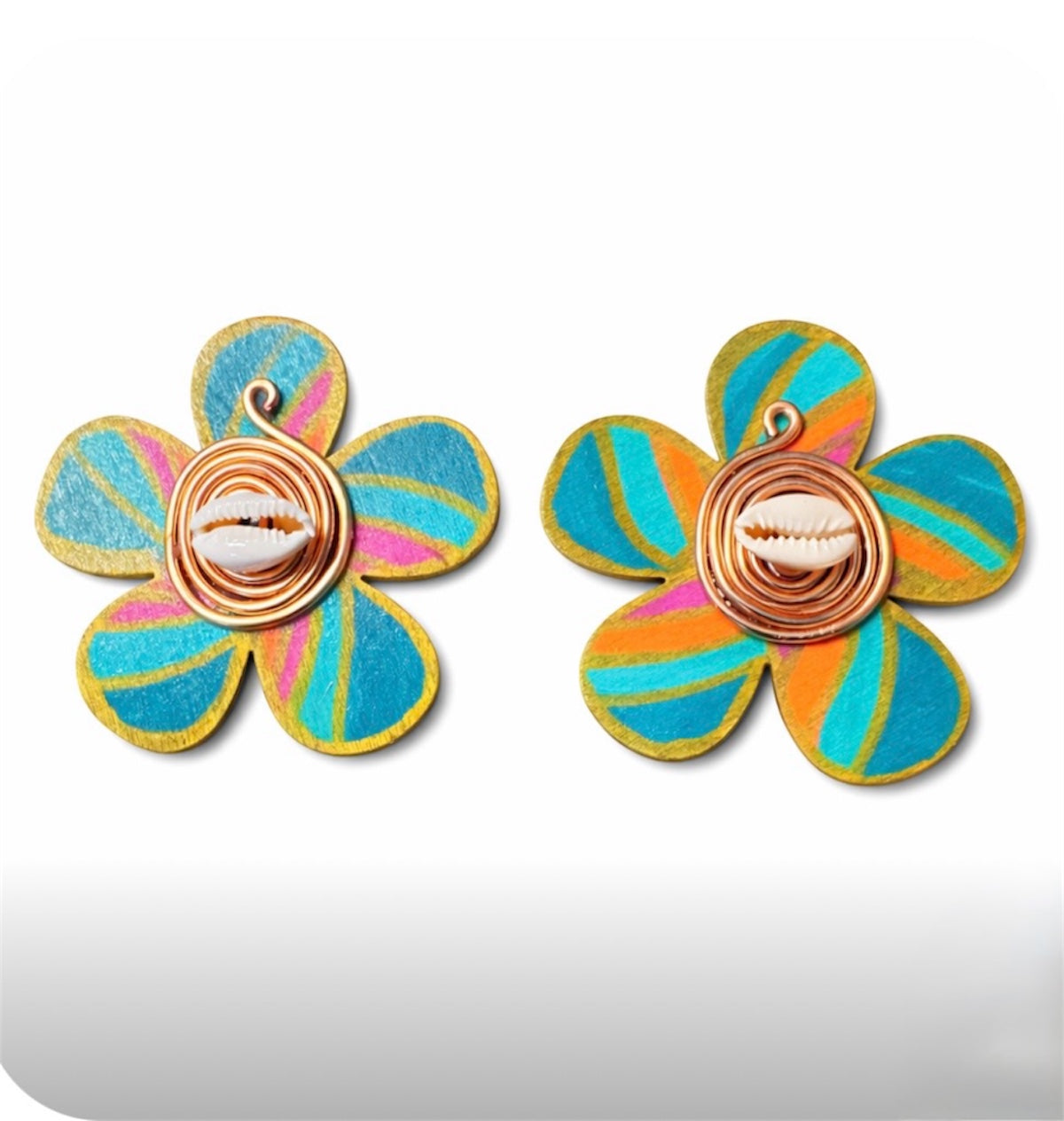 Afrocentric handmade floral statement earrings with teal, orange and gold painted wood petals featuring cowrie shell center and copper wire detail on white background