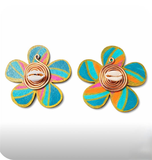 Afrocentric handmade floral statement earrings with teal, orange and gold painted wood petals featuring cowrie shell center and copper wire detail on white background