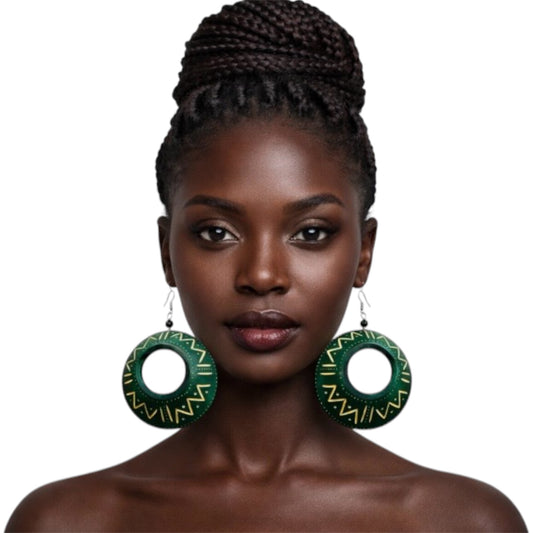 Beautiful dark skin woman with braided updo wearing afrocentric green calabash statement earrings with gold tribal patterns bold cultural handmade jewelry