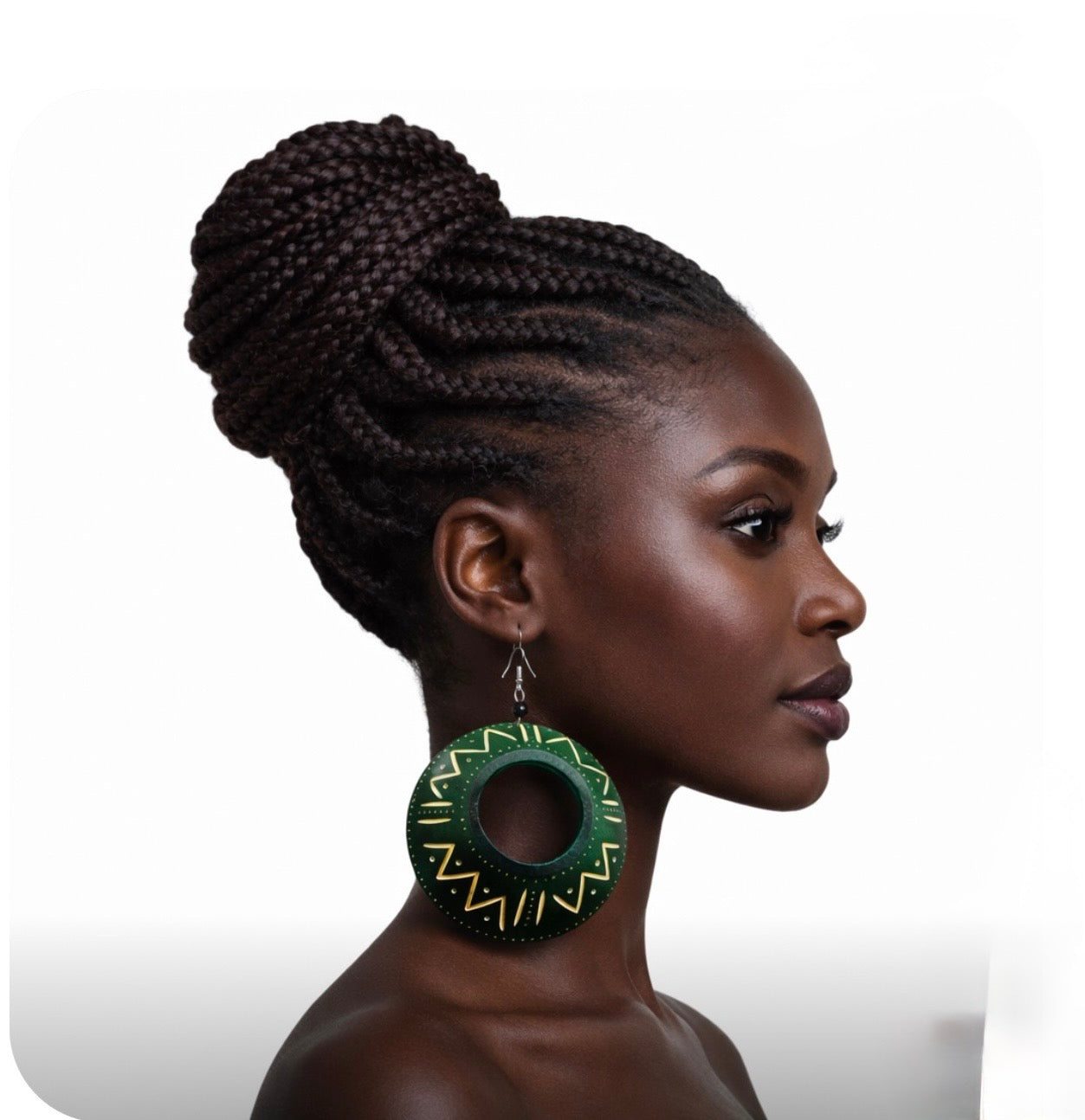 Side profile of a beautiful dark skin woman with braided updo wearing afrocentric green calabash statement earrings with gold tribal patterns bold handmade cultural jewelry
