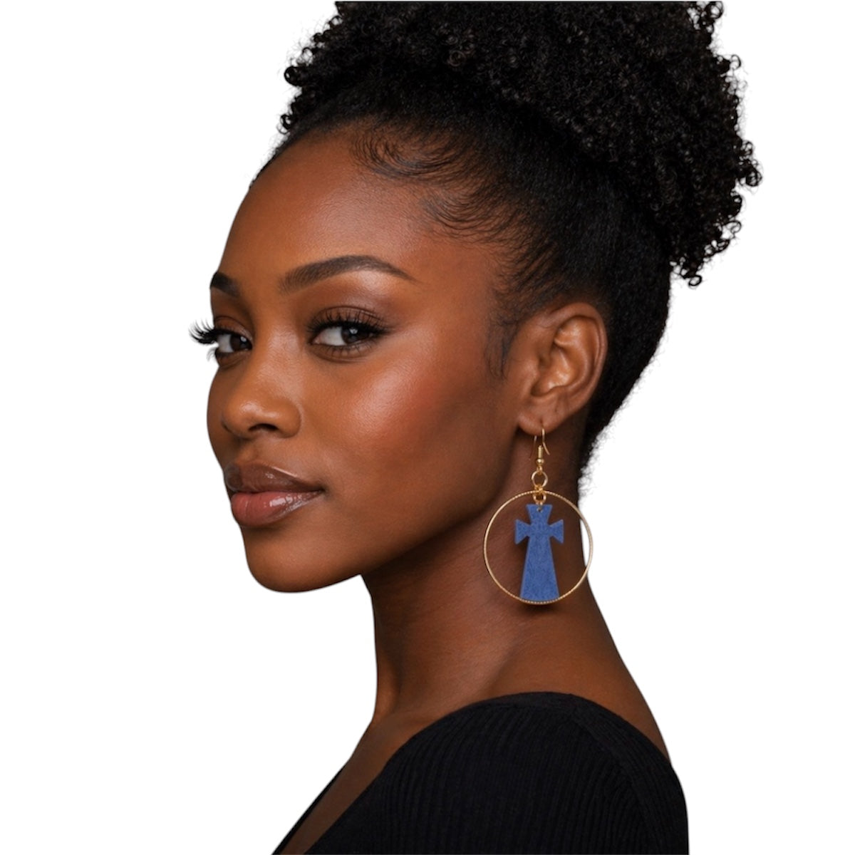 Side profile of Black woman wearing afrocentric grey cross hoop earrings showing detail and size