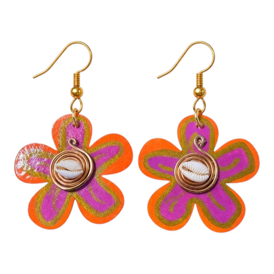 Afrocentric Sunset Bloom Earrings on white background featuring orange and pink flower-shaped statement earrings with cowrie shell centers and gold hooks