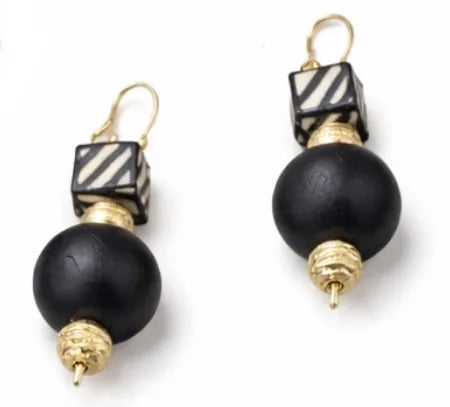 Black and gold earrings with striped square beads on a white background