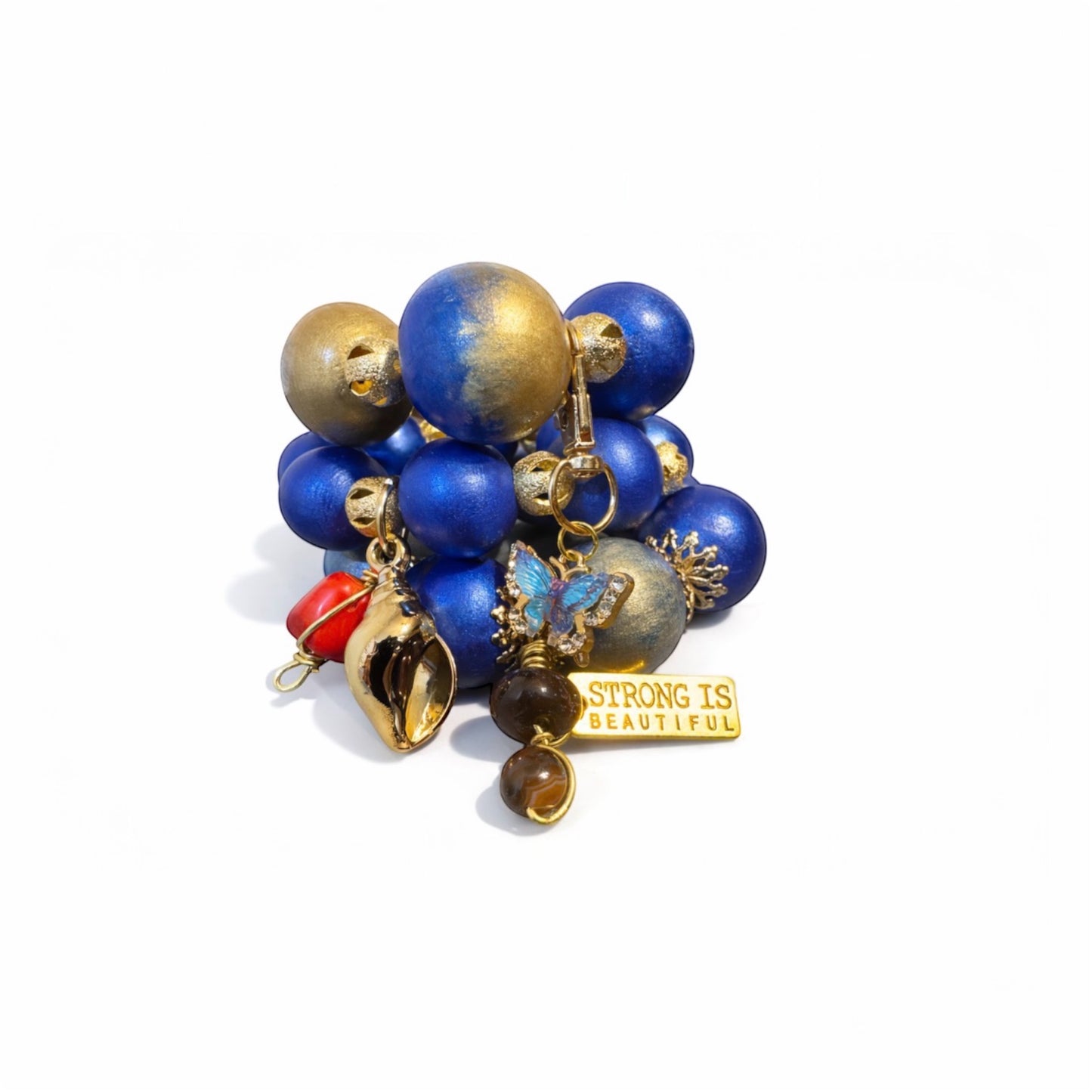 Chunky statement bracelet trio featuring 25mm hand-painted wood beads in royal blue and gold with bold Afrocentric charm details