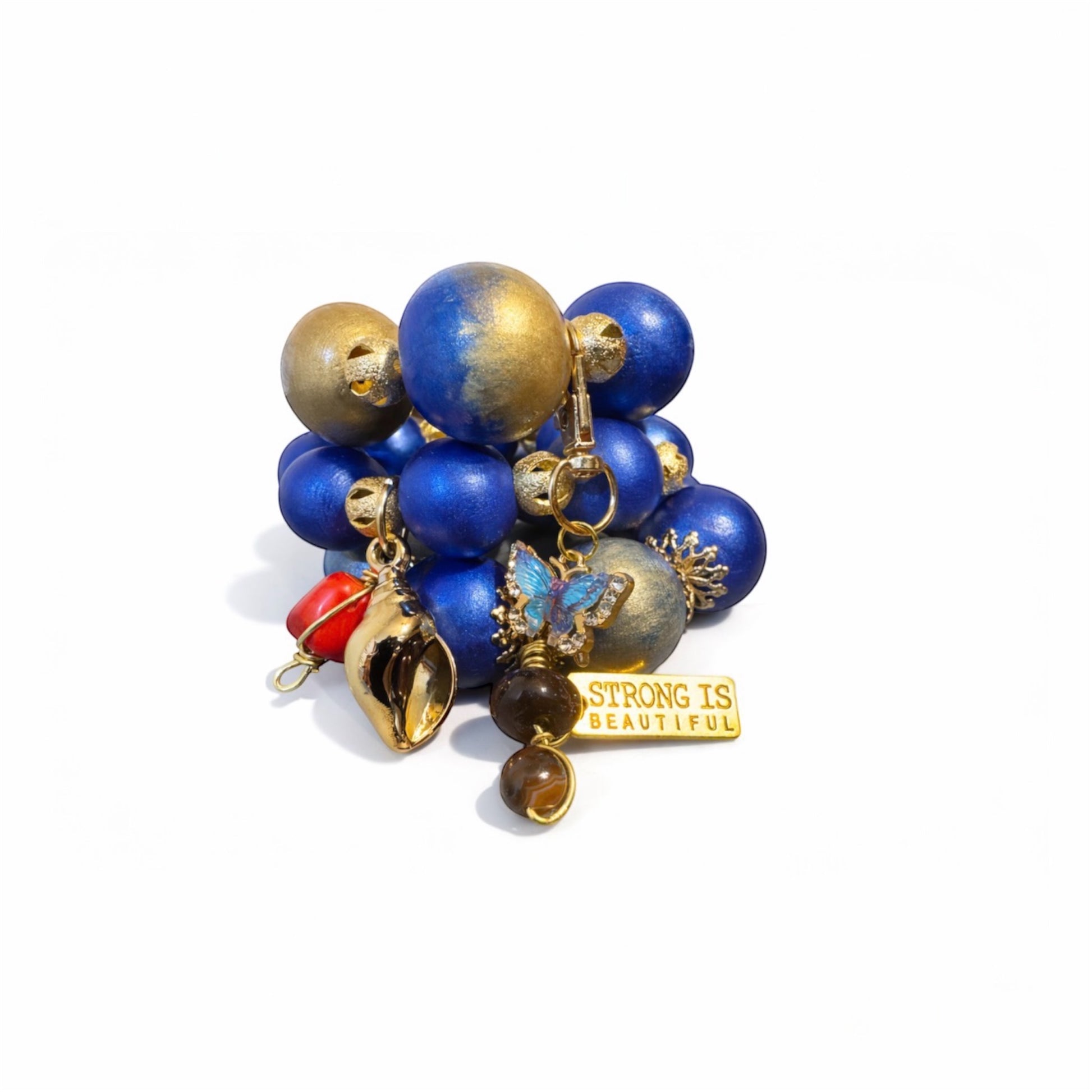 Chunky statement bracelet trio featuring 25mm hand-painted wood beads in royal blue and gold with bold Afrocentric charm details