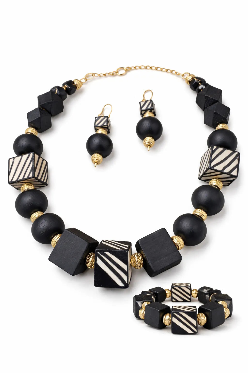 Afrocentric black and white geometric bead necklace set with matching dangle earrings and stretch bracelet, gold spacers, statement jewelry set