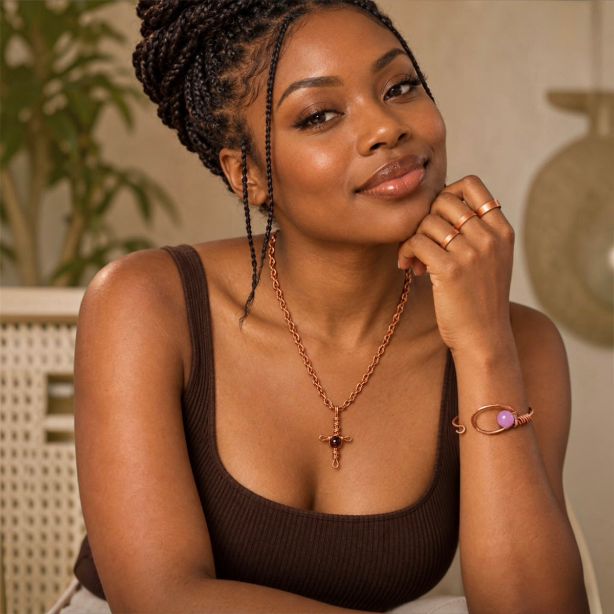 Black woman wearing handmade pure copper necklace bracelet and copper rings
