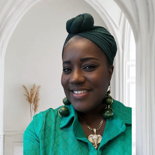 Green knotted turban headwrap paired with lightweight, 5-inch handmade beaded earrings wrapped in gold wire.