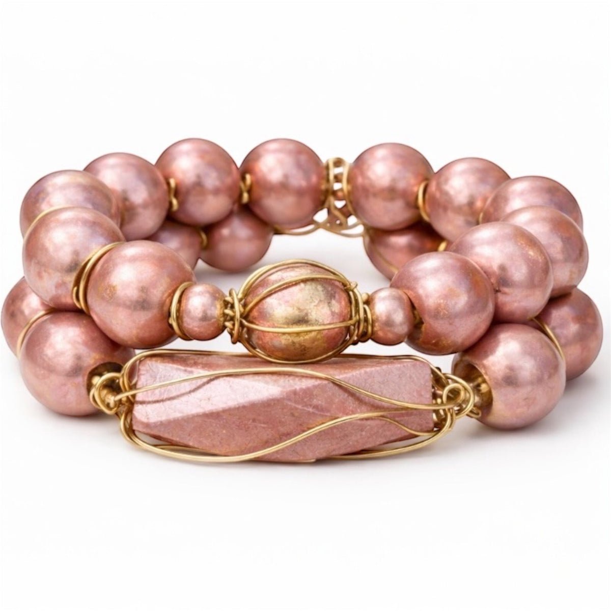 Queen Mother Blush Gold Afrocentric bracelet stack set with oversized blush metallic beads and gold wire-wrapped focal bead on white background